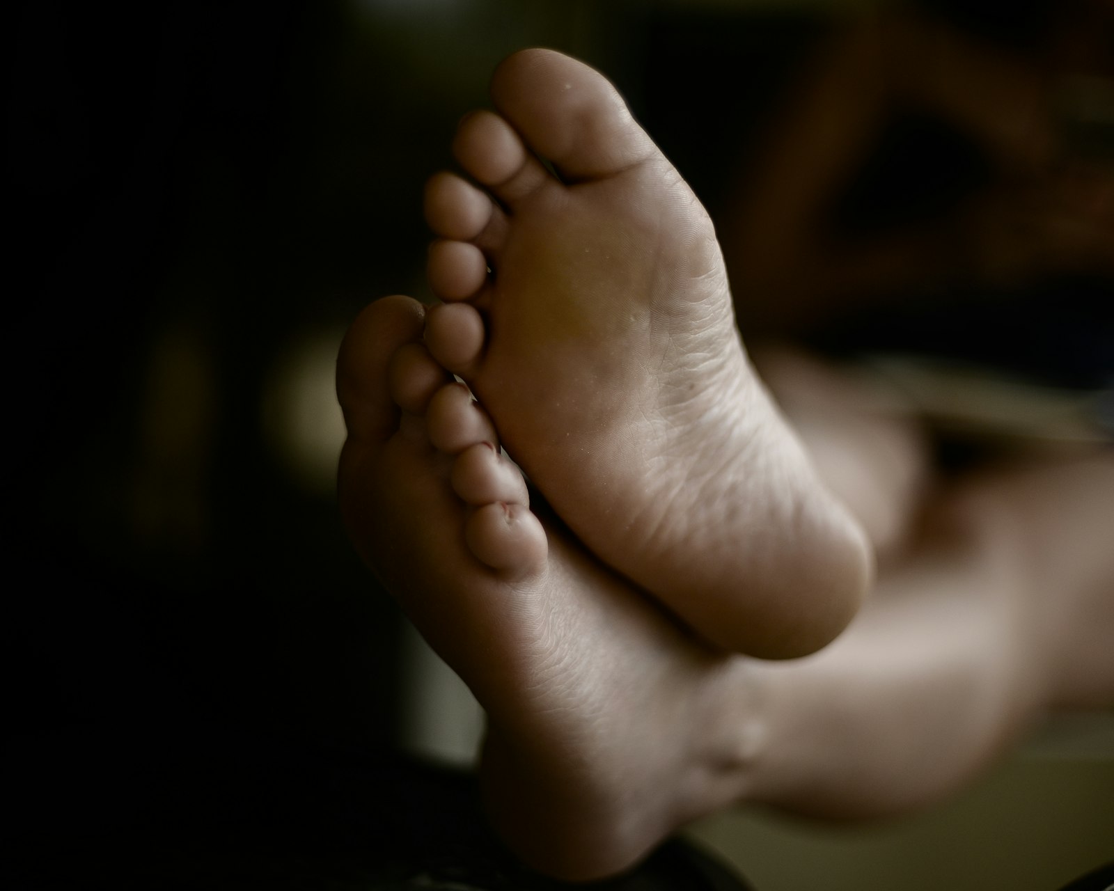 Close-up of bare feet, representing podiatric care